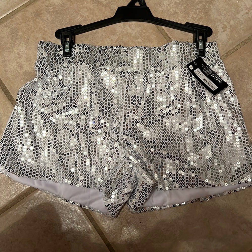 Cute silver sequence shorts with tags still on! Brand new!